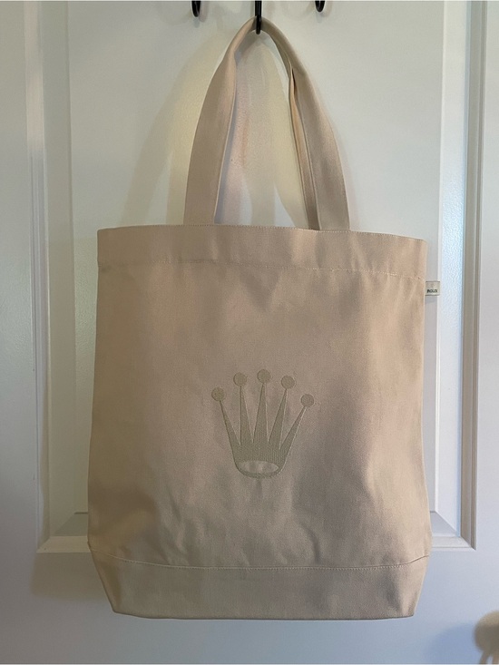 Rolex Handbags - Rolex Cream Canvas Tote with Embroidered Crown Emblem